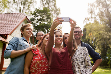 Image showing friends taking selfie at party in summer garden