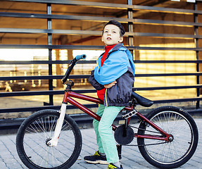 Image showing young kid on cool bmx bicycle riding outside, lifestyle people c