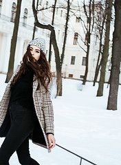 Image showing young pretty stylish modern hipster girl outside on street, fash