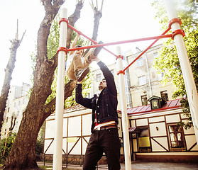 Image showing Father with son on playground training, happy real family smiling outside, lifestyle people concept