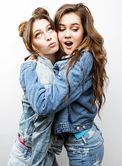 Image showing lifestyle and people concept: Fashion portrait of two stylish sexy girls best friends, over white background. Happy time for fun.