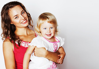 Image showing young pretty stylish mother with little cute daughter hugging, h