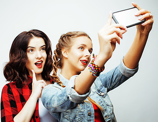 Image showing lifestyle and people concept: Fashion portrait of two stylish sexy girls best friends, over white background. Happy time for fun.