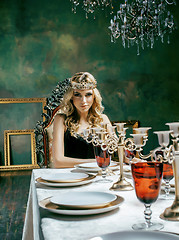 Image showing young blond woman wearing crown in fairy luxury interior with em