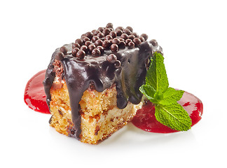 Image showing biscuit cake with chocolate and strawberry sauce