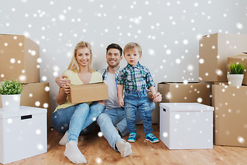 Image showing happy family with boxes moving to new home