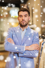 Image showing young handsome man in jacket at clothing store