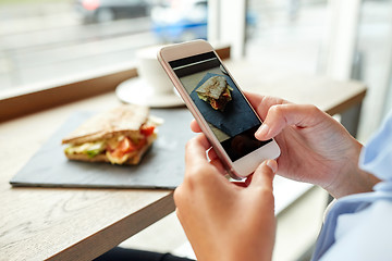Image showing hands with smartphone photographing food