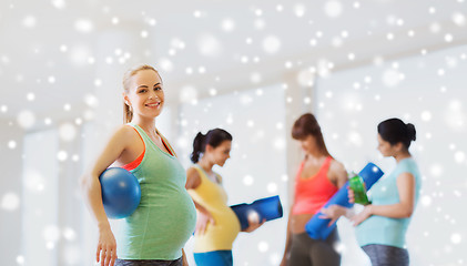 Image showing happy pregnant woman with ball in gym