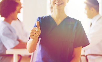 Image showing close up of doctor showing thumbs at hospital