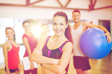 Image showing woman standing in front of the group in gym