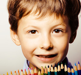 Image showing little cute boy with color pencils close up smiling, education f