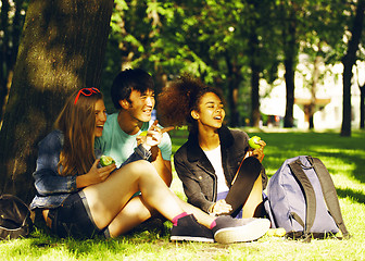 Image showing cute group of teenages at the building of university with books 