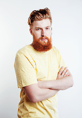 Image showing young handsome hipster ginger bearded guy looking brutal isolated on white background, lifestyle people concept