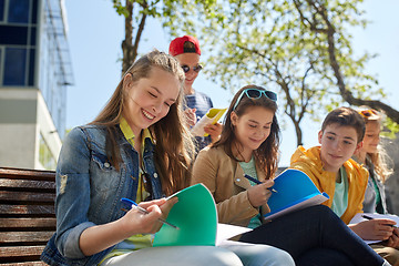 Image showing group of students with notebooks at school yard