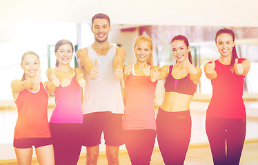 Image showing group of people in the gym showing thumbs up