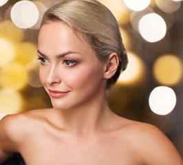 Image showing close up of young woman sitting in bath towel