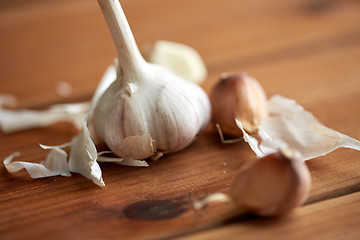 Image showing close up of garlic on wooden table