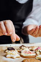 Image showing Person finishing homemade cookies