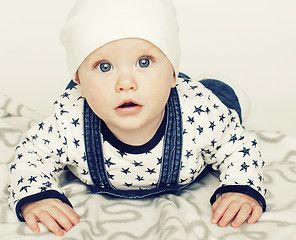 Image showing little cute baby toddler on carpet isolated close up smiling ado