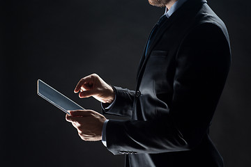 Image showing close up of businessman with transparent tablet pc