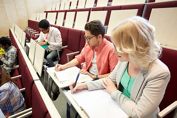 Image showing group of students with notebooks at lecture hall