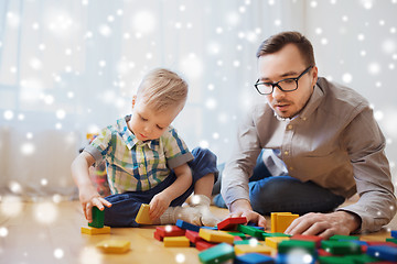 Image showing father and son playing with toy blocks at home