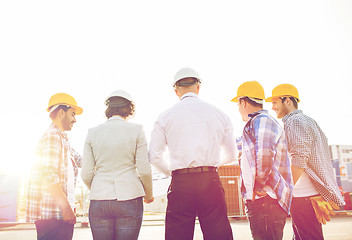 Image showing group of builders and architects at building site