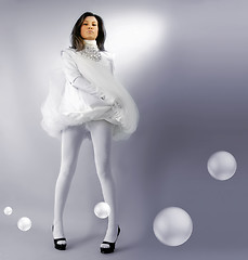 Image showing beautiful snow-white girl with bubbles