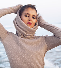 Image showing young pretty woman in sweater at seacoast walking relaxing