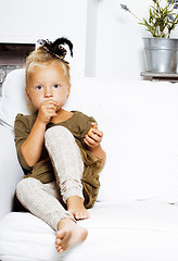 Image showing little cute blonde norwegian girl playing at home with pillows