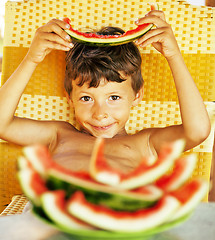 Image showing cute young little boy with watermelon crustes smiling