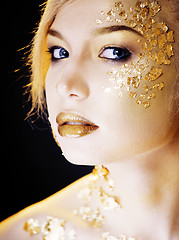 Image showing beauty blond woman with gold creative make up, bokeh on yellow background