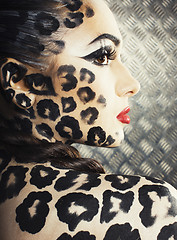 Image showing young sexy woman with leopard make up all over body, cat bodyart