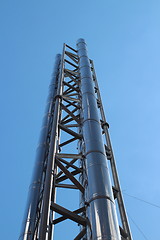 Image showing  smokestack is shooting into the clear sky