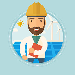 Image showing Male worker of solar power plant and wind farm.