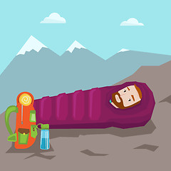 Image showing Man sleeping in sleeping bag in the mountains.