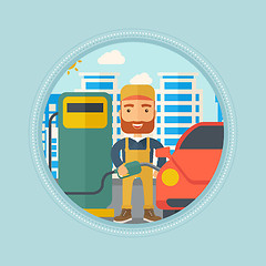 Image showing Worker filling up fuel into car.