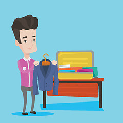 Image showing Young man packing his suitcase vector illustration