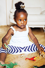 Image showing little cute african american girl playing with animal toys at ho