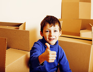 Image showing little cute boy in empty room, remoove to new house. home alone, lifestyle people concept