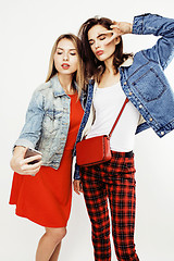 Image showing best friends teenage girls together having fun, posing emotional on white background, besties happy smiling, lifestyle people concept