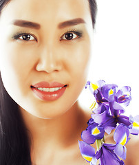 Image showing young pretty asian woman with flower orchid close up isolated sp