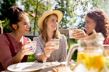 Image showing happy friends having party at summer garden