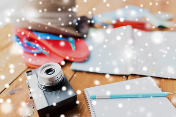 Image showing close up of camera, notepad and travel stuff