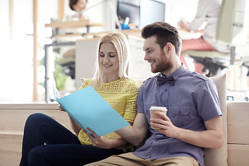 Image showing office workers with folder and coffee