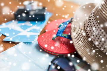 Image showing close up of travel tickets, flip-flops and hat