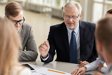 Image showing architects with tablet pc and blueprint at office