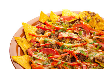 Image showing spicy nachos with pork, tomato and pepper