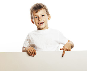 Image showing little cute boy holding empty shit to copyspace isolated close u